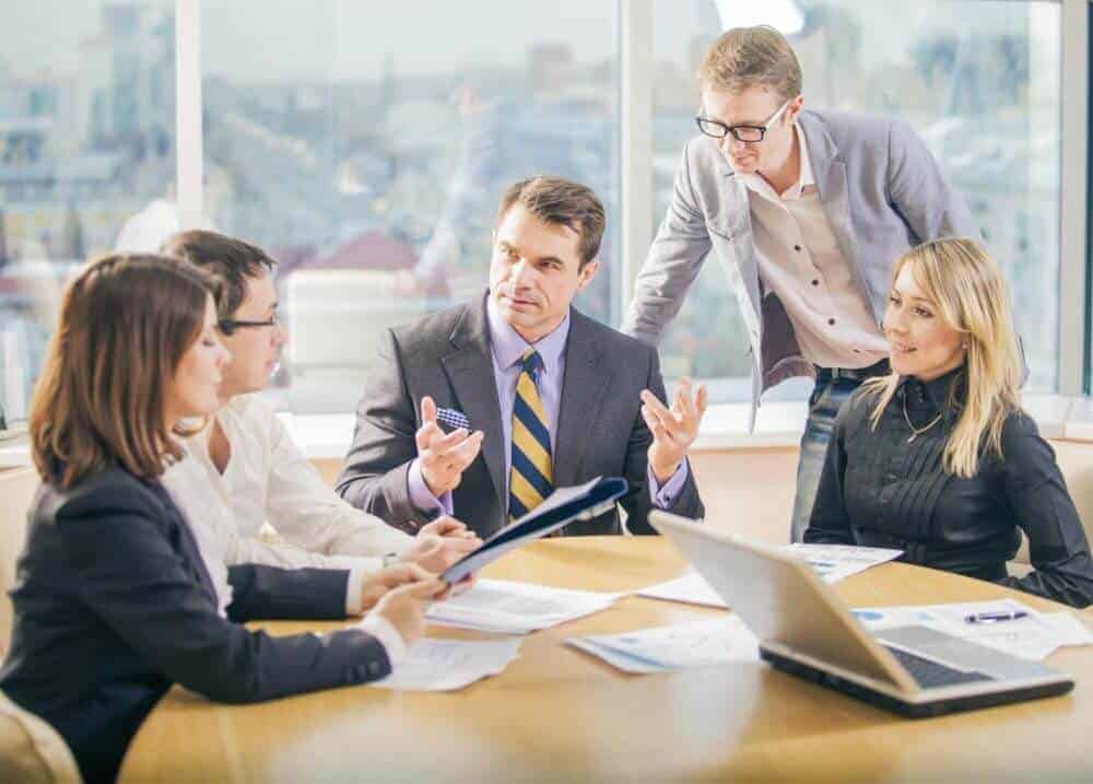Business people discussing the legal requirements for starting a small business as a limited liability company